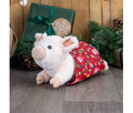 Ancol Paloma Pig in Blanket plush dog toy with a pale pink snout and ears and a red Christmas-patterned blanket around its cream body.