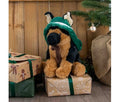 Ancol Wolfgang German Shepherd tan and black plush dog toy wearing a green festive hood, seated on a wrapped Christmas present.