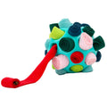 Ancol Örva Snuffle Ball with a turquoise open ball frame holding colourful rolled fabric strips, including a red strip unrolled to show treats.